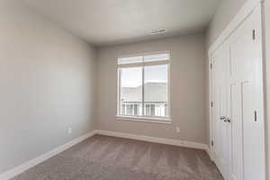 Interior space featuring a textured ceiling