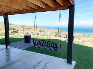 View of terrace featuring a water view