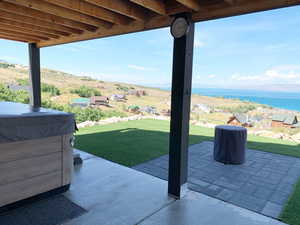 View of patio / terrace with a water view