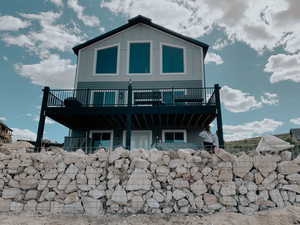 Rear view of house with a balcony