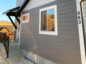 View of property exterior featuring a mountain view