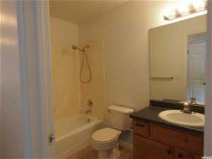 Upstairs  full bathroom featuring tile flooring, shower / bath combination, vanity, and toilet