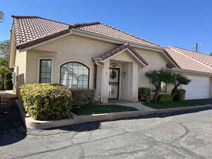 View of front facade featuring a garage