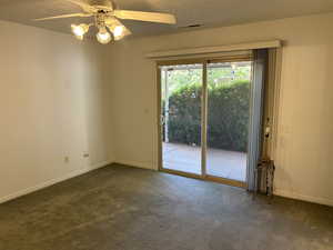 Master Bedroom featuring ceiling fan, a textured ceiling