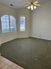 Living room with lofted ceiling, and ceiling fan