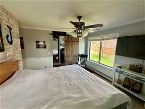 Bedroom featuring ceiling fan and baseboard heating