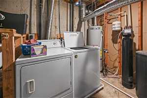 Laundry area with hookup for an electric dryer, washing machine and dryer, and strapped water heater
