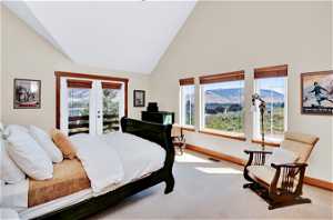 Bedroom with a mountain view, french doors, high vaulted ceiling and adjoining bathroom