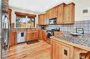 Stainless steel appliances, alder cabinets including pantry cabinets and lazy susans.