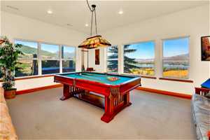 Recreation room featuring carpet, billiards, and a mountain view