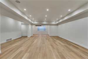 Basement featuring light hardwood / wood-style floors