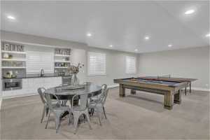 Recreation room with light hardwood / wood-style flooring, sink, and billiards