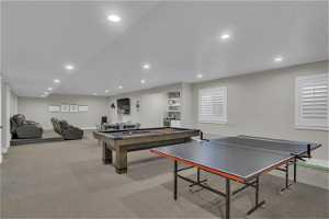 Game room featuring light carpet and pool table