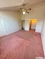 Master Bedroom with carpet, ceiling fan, and lofted ceiling
