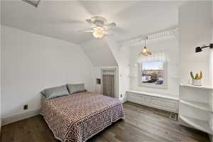 Bedroom with ceiling fan, vaulted ceiling, and white oak hardwood flooring