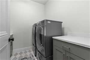 Full laundry with tile flooring