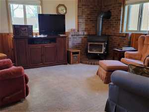 Daylight basement family room with wood burning stove