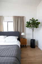 Bedroom featuring wood-type flooring