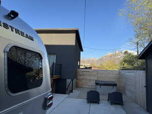 View of terrace/hot tub area featuring a mountain view