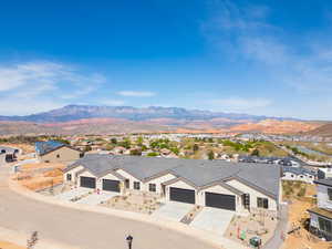 Property view of mountains with a residential view