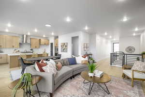 Living room with light hardwood / wood-style flooring