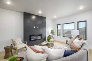 Living room featuring a fireplace and light hardwood / wood-style floors