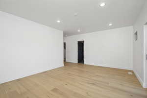 Unfurnished room featuring light hardwood / wood-style flooring