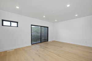 Empty room featuring light wood-type flooring