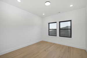 Spare room with light wood-type flooring