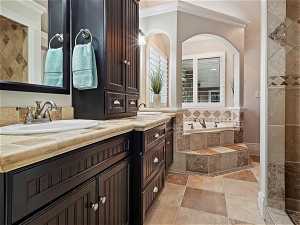 En-suite master bath with double vanity and a beautiful jetted tub and a walk-in shower
