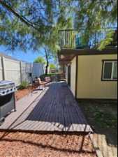 Wooden deck featuring grilling area