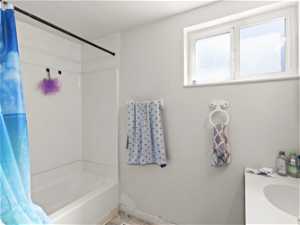 Bathroom with sink and shower / bath combo