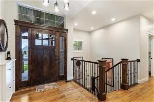 Entryway with light and hardwood floors