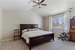 Beautiful large primary bedroom with vaulted ceilings