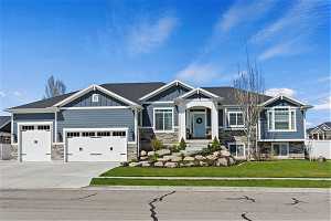 Craftsman-style home with Extra-Large & Extra-Tall Garage that can accommodate 6 cars and/or all your toys