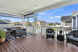 You'll love this expansive covered deck with electric sun shades, so great for summer days