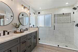 Fully remodeled en-suite bathroom with an extra large shower, double sink and oversized vanity