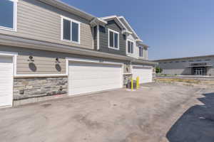 View of front of property featuring a garage