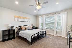 Large Master Bedroom bedroom with ceiling fan and a textured ceiling