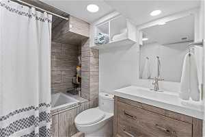 Beautifully remodeled full bath with shower / soaking tub combo, oversized vanity