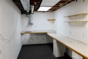 Extra large storage or craft room with electrical, plumbed sink, and counters