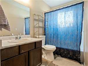Bathroom with tile floors, vanity with extensive cabinet space