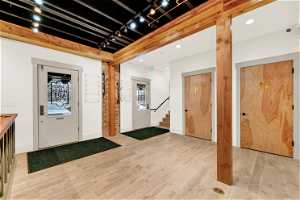 Foyer entrance with light hardwood / wood-style floors
