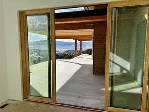 Doorway to outside featuring a mountain view