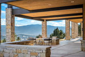 View of patio with a mountain view and grilling area