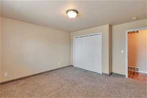 Unfurnished bedroom featuring a closet.