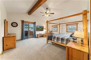 Bedroom with light carpet, ceiling fan, lofted ceiling with beams, and access to outside