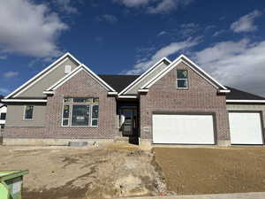 View of front of home featuring a garage