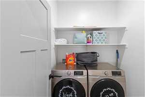 Laundry room featuring washer hookup and washing machine and dryer