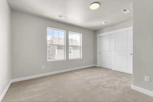 Interior space featuring light colored carpet